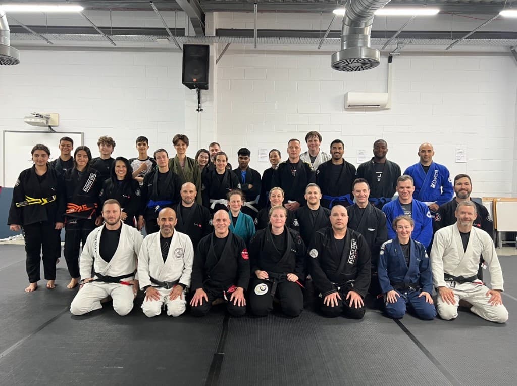 A Jiu Jitsu group portrait on the mats